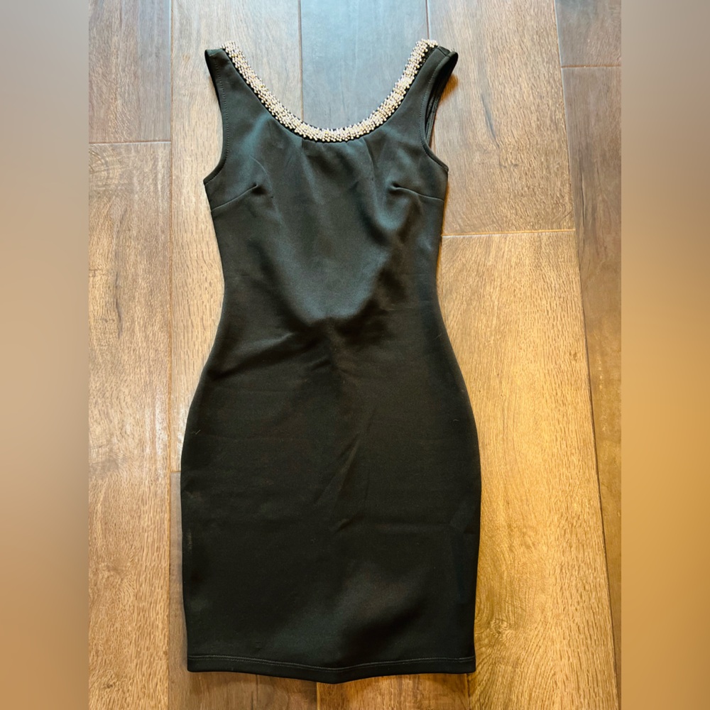 Elegant Black Sleeveless Dress with Embellished Neckline
